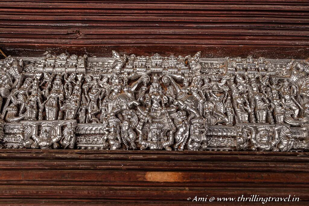 Silver paint on the wood carving of the Pooja Room Door