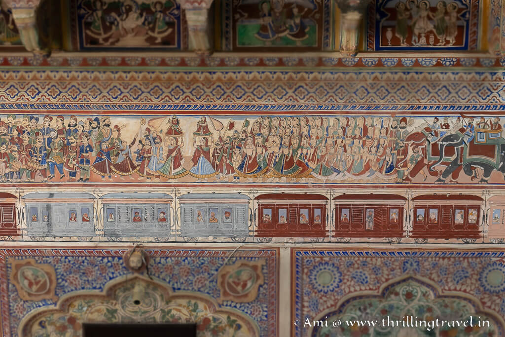 A close up of the Teej festival fresco and the train fresco