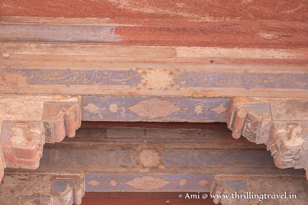Quranic verses etched on the blue paint inside the Fatehpur Sikri palace of Maria