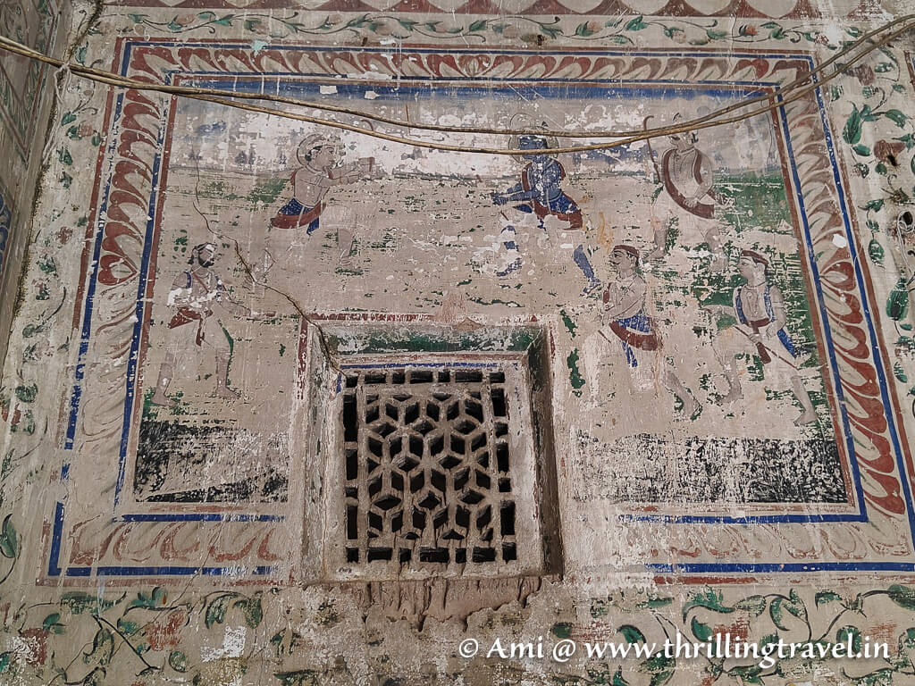 The faded fresco of Lord Krishna playing hockey