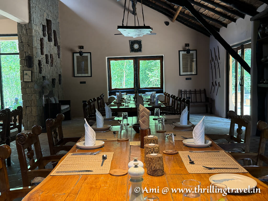 The mud and stone interiors of the dining area of the Kanha Earth Lodge