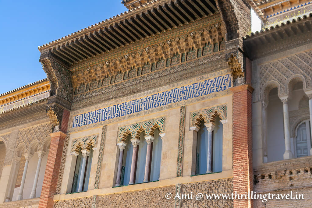 Close-up of the inscriptions on the facade of Palacio de Pedro in Seville